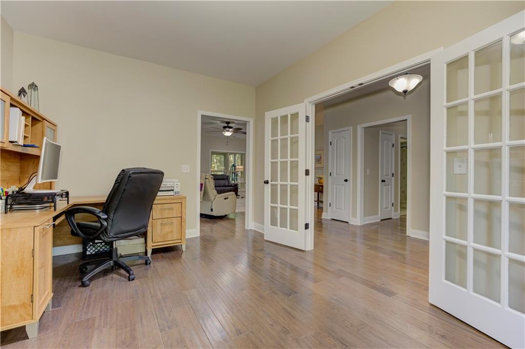 304 Garland Way Canton, GA 30115 - Photo 91 of 138 a view of a workspace with furniture and a window