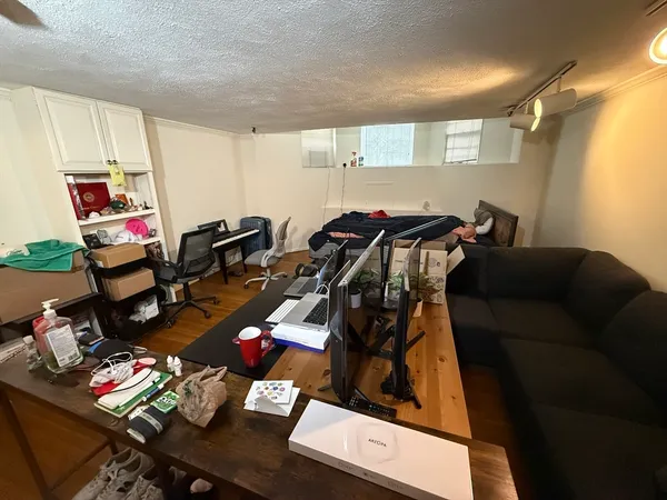 a room with gym equipment and a window