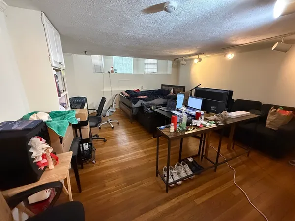 a workspace with furniture and wooden floor