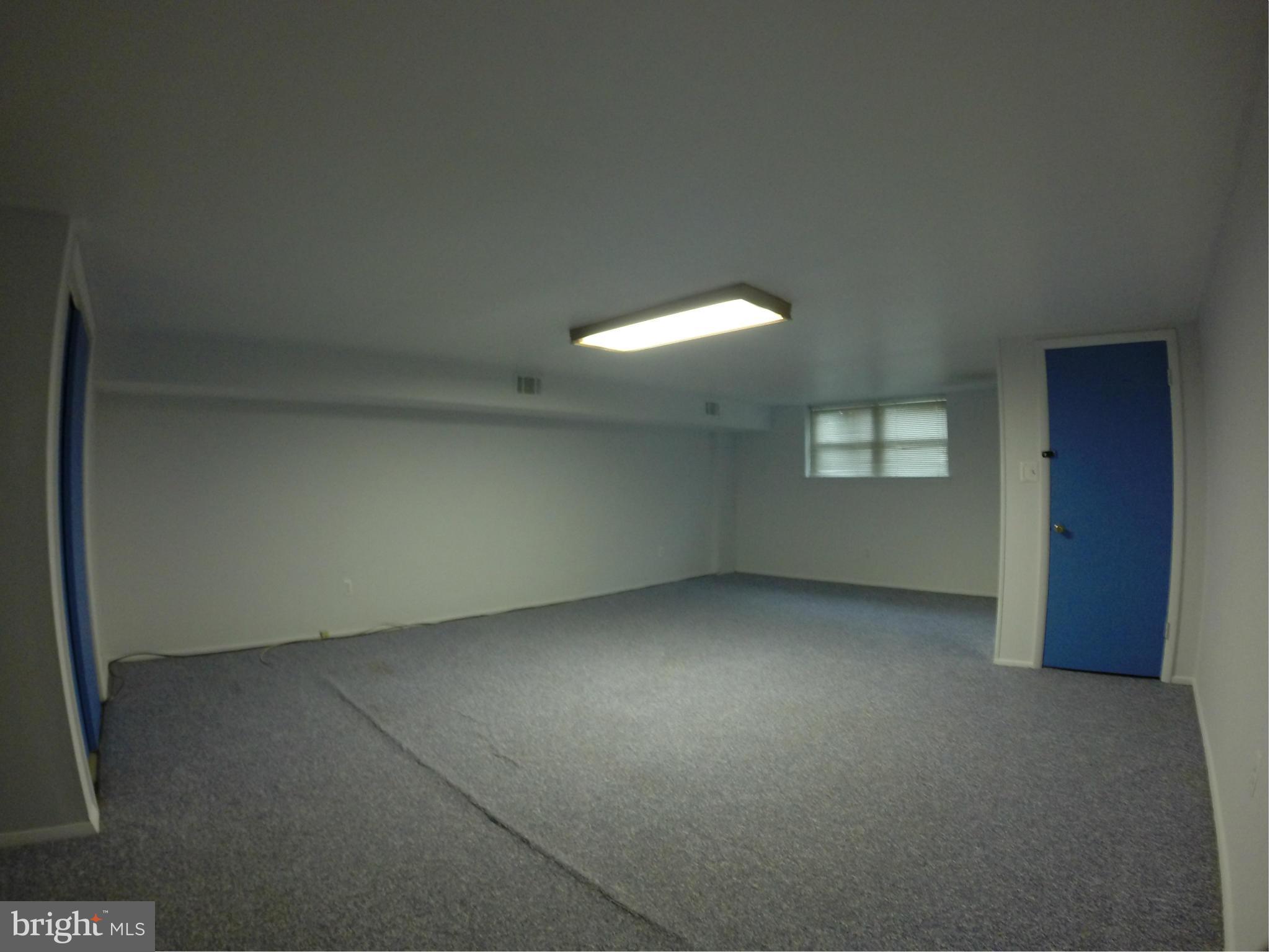 919 Elm Road Baltimore, MD 21227 - Photo 14 of 18 an empty room with a window