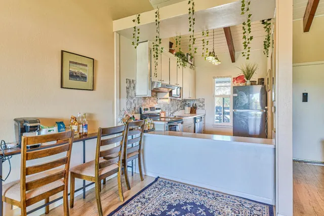 a kitchen that has a lot of cabinets in it