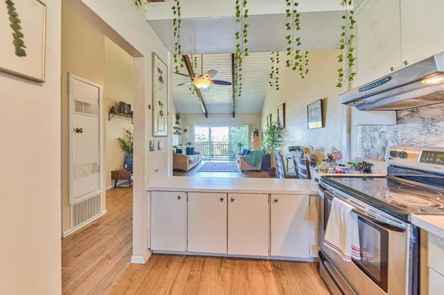 a bathroom with a sink toilet mirror and shower