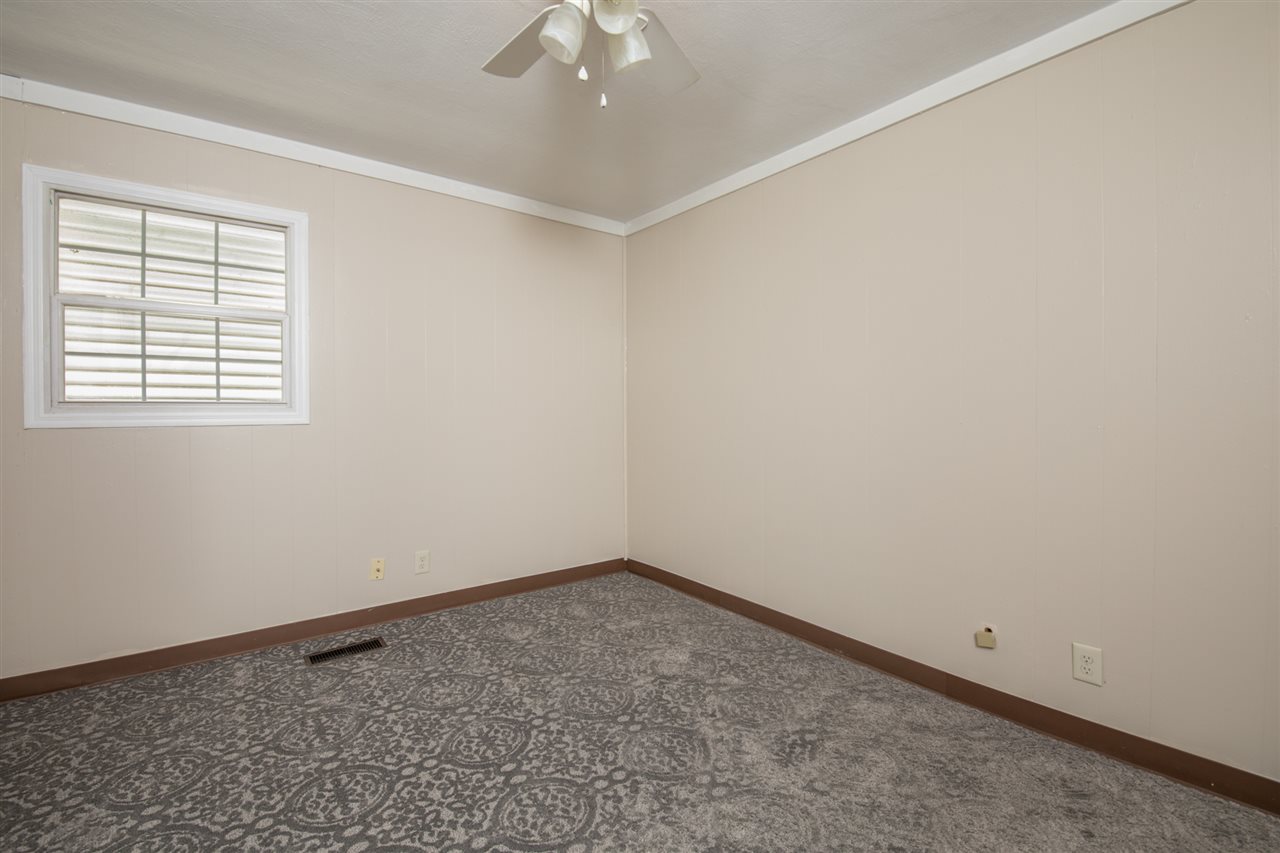 7712 Randy Road Machesney Park, IL 61115 - Photo 16 of 25 an empty room with a window
