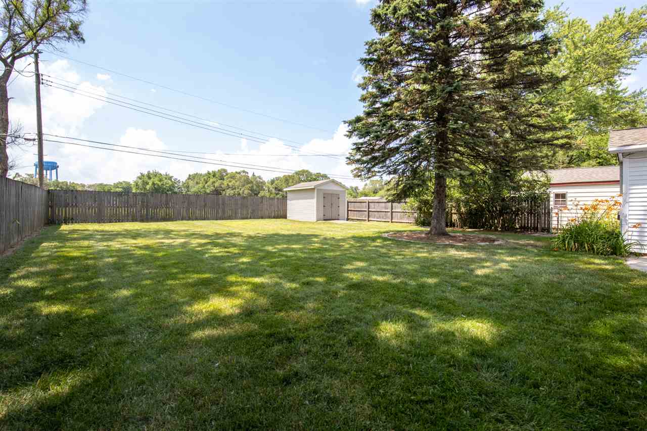 7712 Randy Road Machesney Park, IL 61115 - Photo 22 of 25 a view of a yard with a house