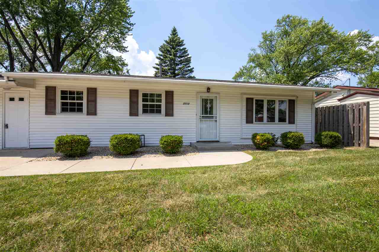 7712 Randy Road Machesney Park, IL 61115 - Photo 3 of 25 a view of a house with a yard