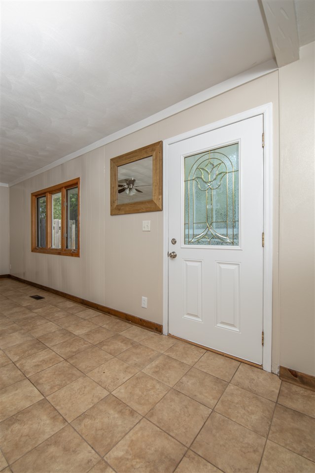 7712 Randy Road Machesney Park, IL 61115 - Photo 4 of 25 a view of an empty room with a window
