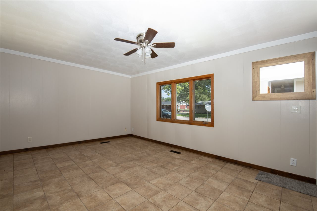 7712 Randy Road Machesney Park, IL 61115 - Photo 5 of 25 a view of an empty room with a window
