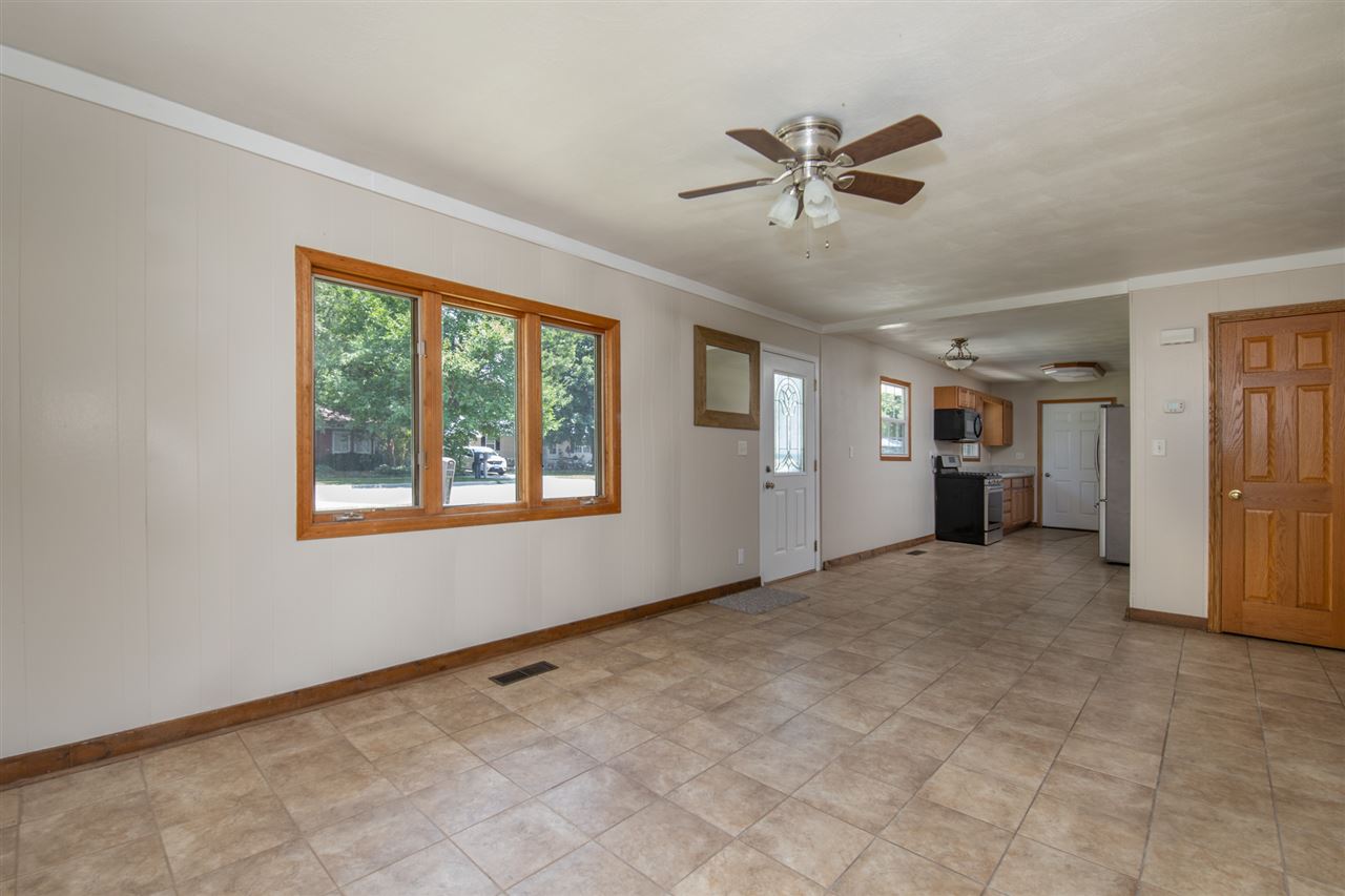 7712 Randy Road Machesney Park, IL 61115 - Photo 6 of 25 a view of an empty room with a window