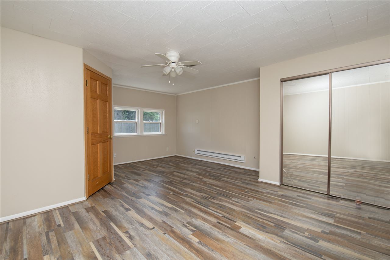 7712 Randy Road Machesney Park, IL 61115 - Photo 10 of 25 wooden floor in an empty room