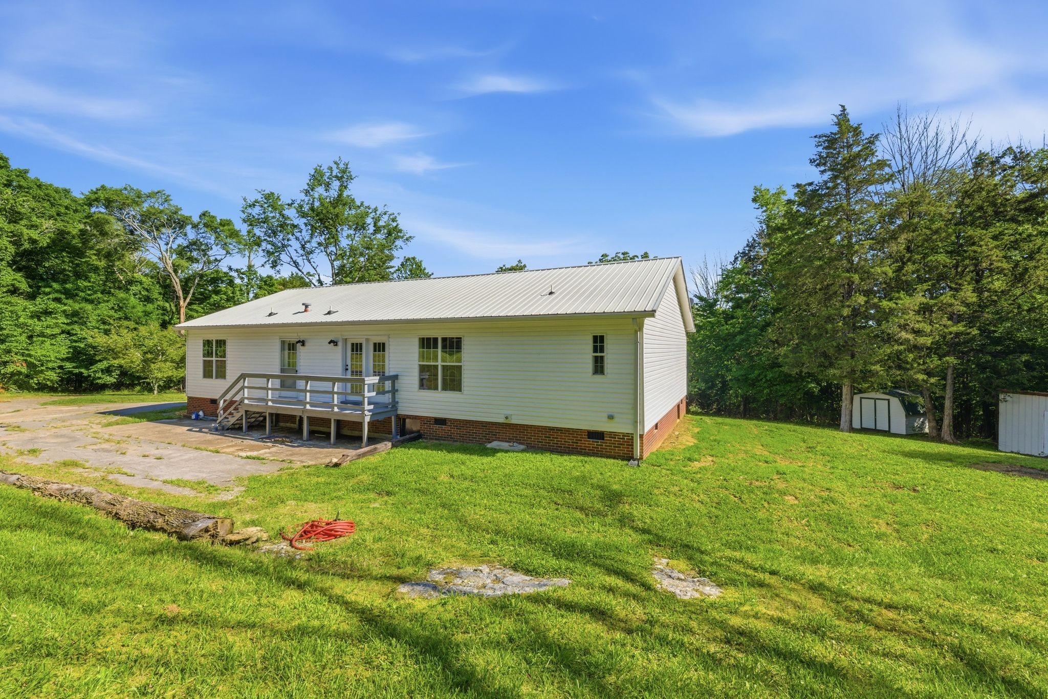1021 B Jordan Road Lascassas, TN 37085 - Photo 49 of 58 a view of a house with a yard porch and sitting area