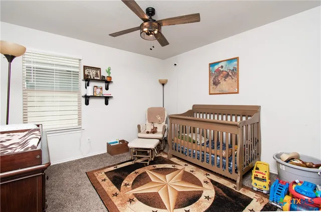 a bedroom with furniture and a window