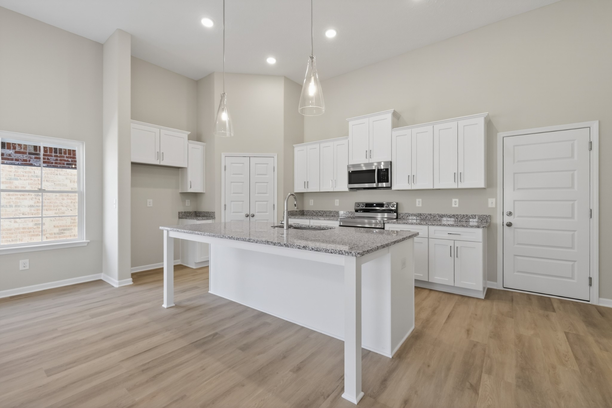 346 North Fork Branch Road Tullahoma, TN 37388 - Photo 12 of 37 a kitchen with granite countertop white cabinets and white appliances