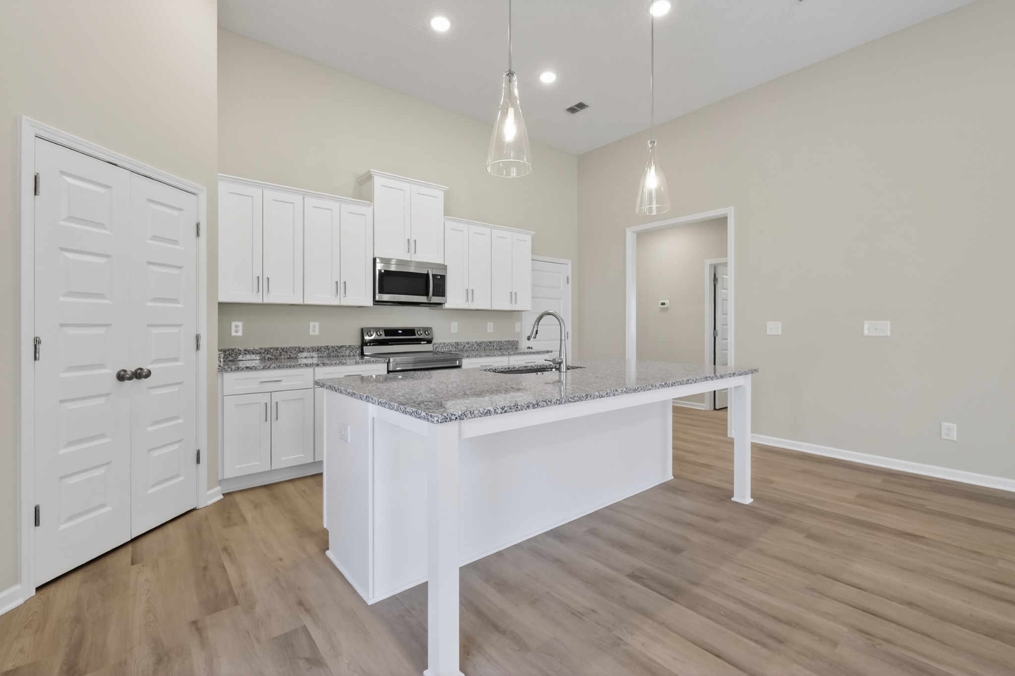346 North Fork Branch Road Tullahoma, TN 37388 - Photo 14 of 37 a kitchen with granite countertop white cabinets and white appliances