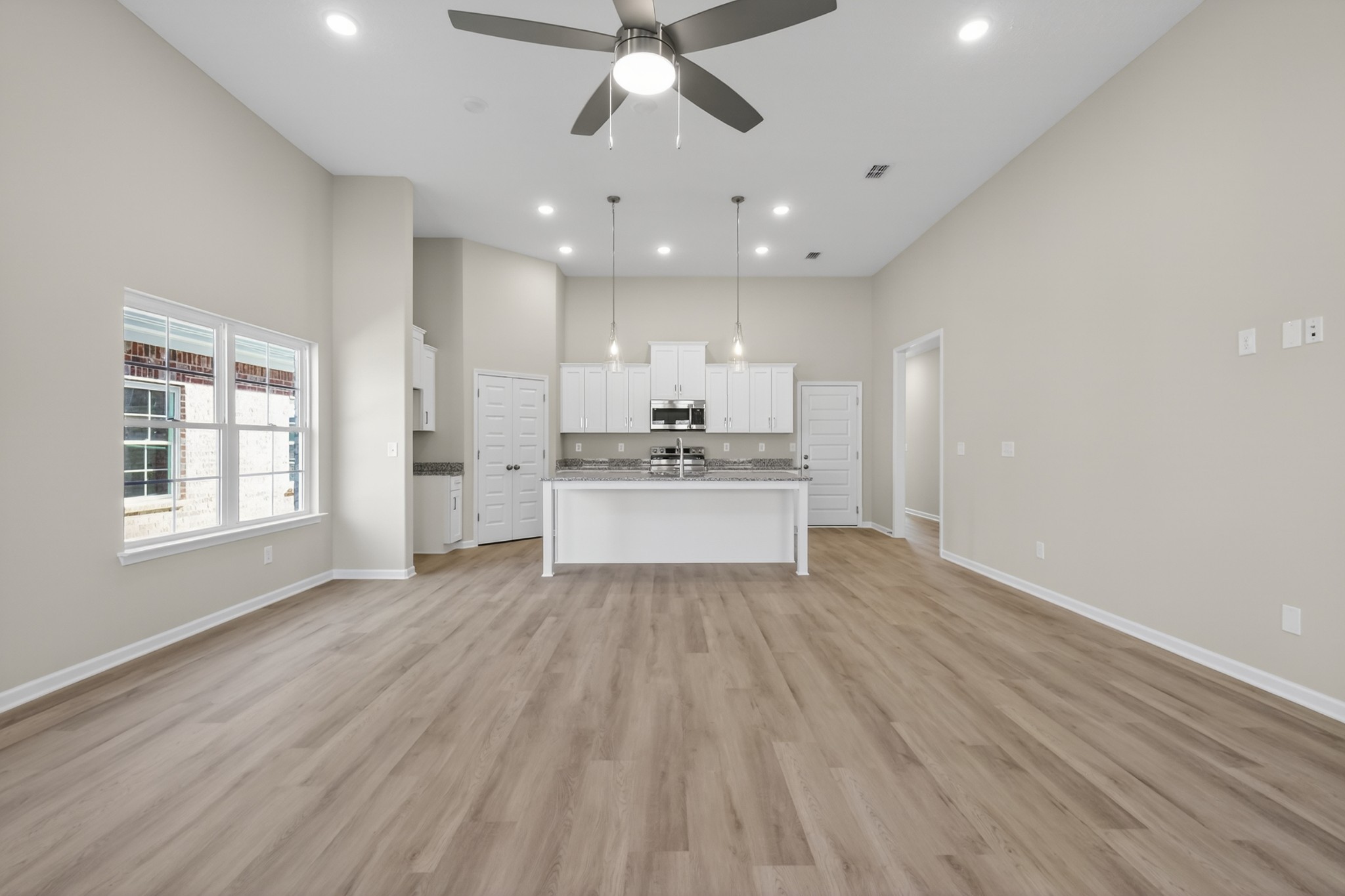 346 North Fork Branch Road Tullahoma, TN 37388 - Photo 20 of 37 a large kitchen with hardwood floor a sink stainless steel appliances and cabinets