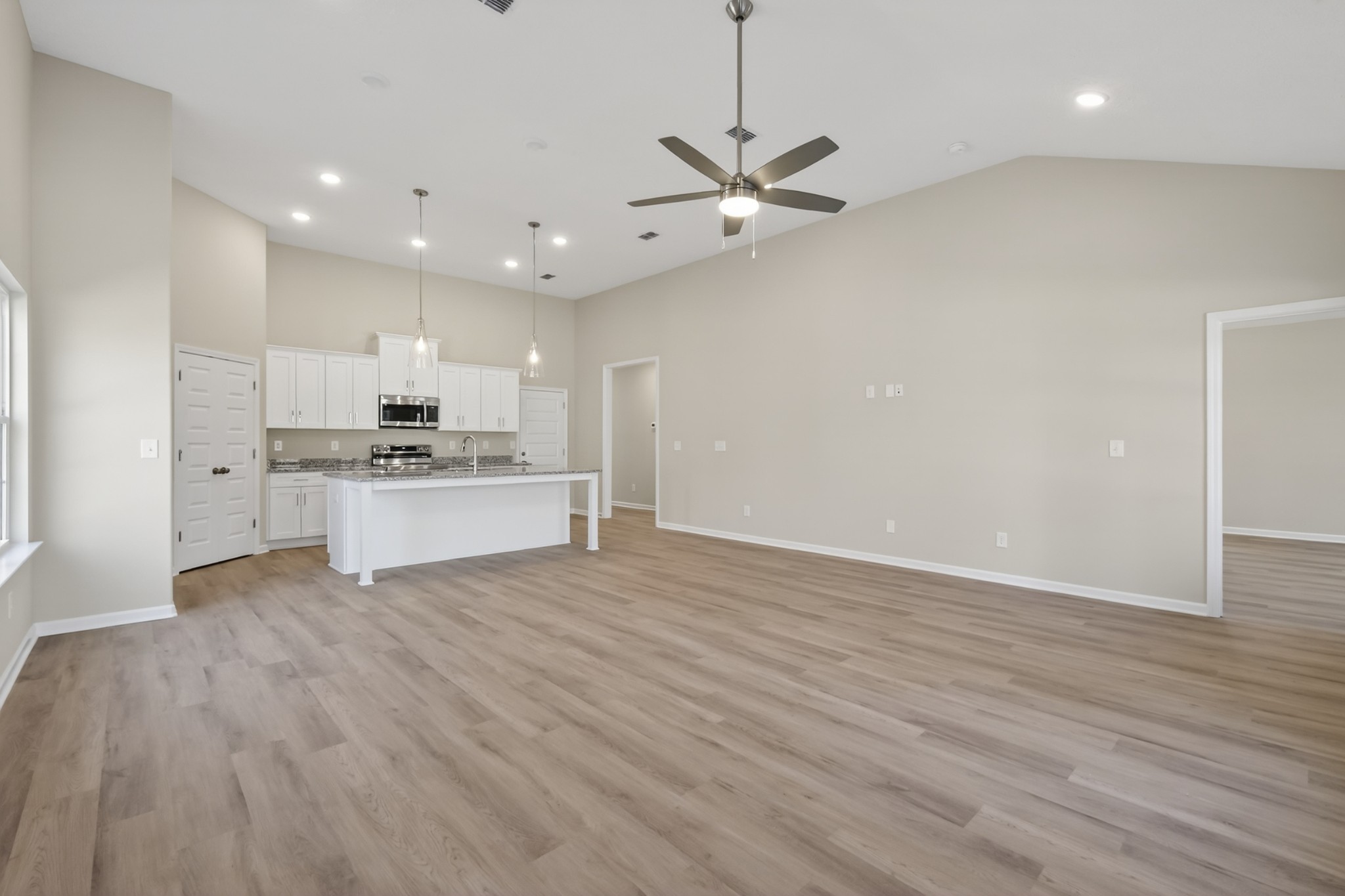 346 North Fork Branch Road Tullahoma, TN 37388 - Photo 21 of 37 a view of kitchen with refrigerator stove and wooden floor