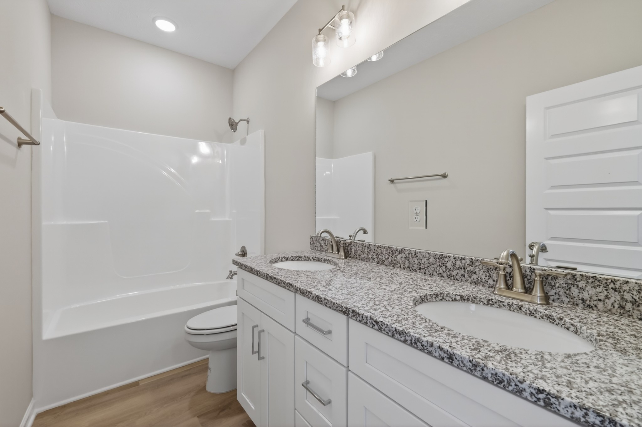 346 North Fork Branch Road Tullahoma, TN 37388 - Photo 6 of 37 a bathroom with a granite countertop double vanity sink a mirror and a bathtub