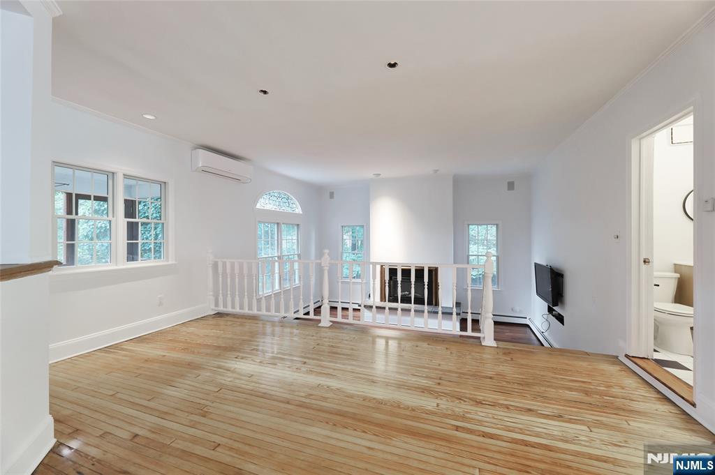 24 Merrifield Way Cresskill, NJ 07626 - Photo 15 of 27 a view of an empty room with kitchen and window