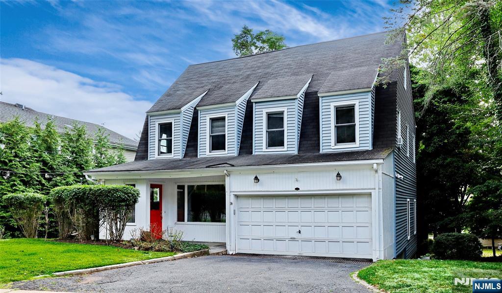 24 Merrifield Way Cresskill, NJ 07626 - Photo 2 of 27 a front view of a house with a yard