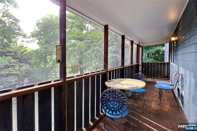 a view of a balcony with chairs