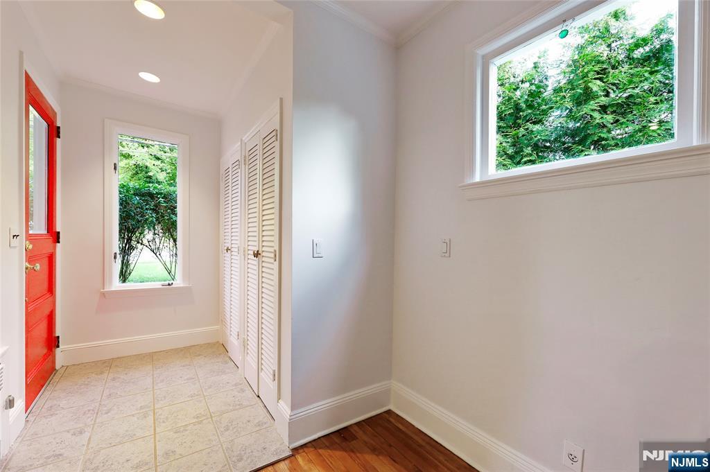 24 Merrifield Way Cresskill, NJ 07626 - Photo 4 of 27 an empty room with wooden floor and a window