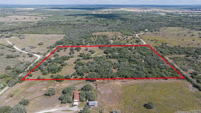 a kitchen with a sink a stove a refrigerator and cabinets