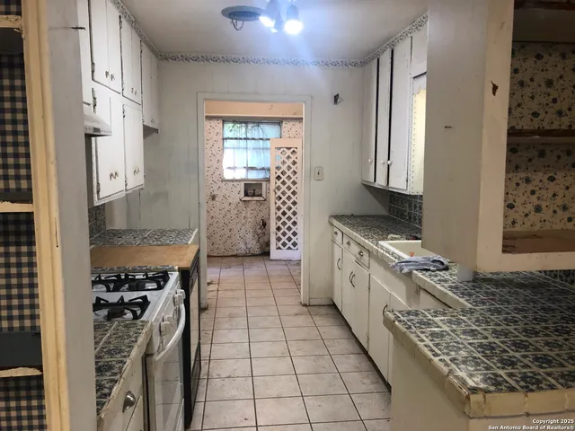 a view of a room with a furniture and a window