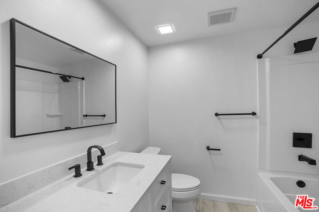 963 Glencliff Street La Habra, CA 90631 - Photo 17 of 31 a bathroom with a sink toilet and shower