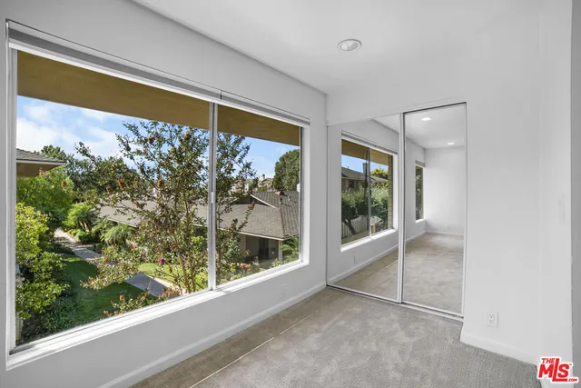 a view of a room with a large window