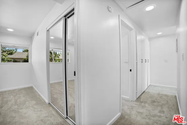 a view of hallway with livingroom