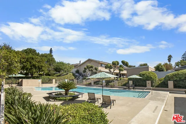 a view of a swimming pool with a patio
