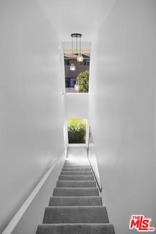 a view of staircase with white walls and white walls