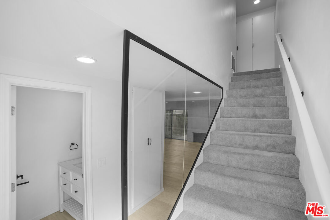 963 Glencliff Street La Habra, CA 90631 - Photo 28 of 31 a view of staircase with white walls and white walls