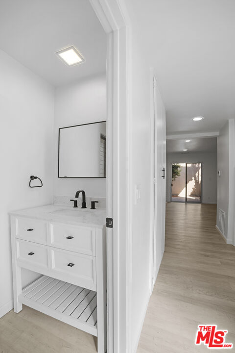 963 Glencliff Street La Habra, CA 90631 - Photo 5 of 31 a view of a hallway with two mirror and lamp