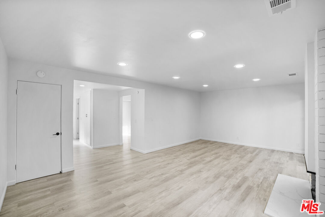 963 Glencliff Street La Habra, CA 90631 - Photo 7 of 31 an empty room with wooden floor and windows