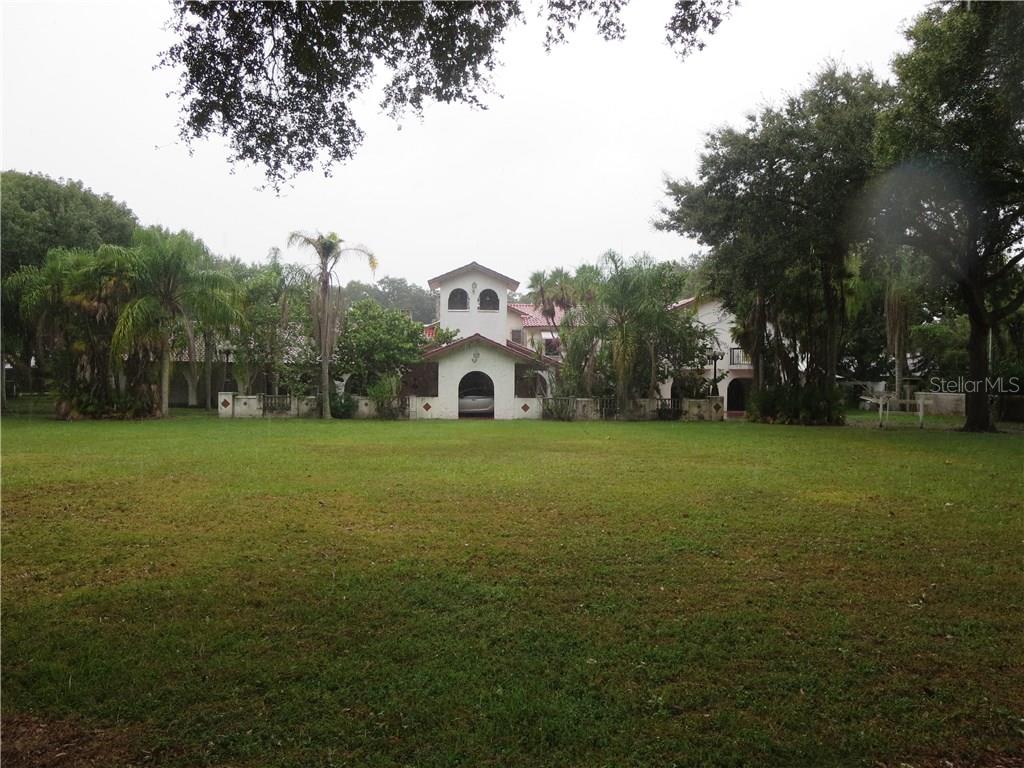 1001 Riviere Road Palm Harbor, FL 34683 - Photo 1 of 1 Sprawling estate with tennis court and huge pool and nearly 2 acres of fenced land.