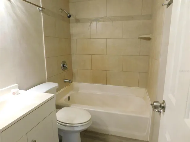 a bathroom with a sink a toilet and a bathtub