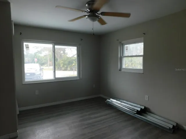 a view of room with window and ceiling fan