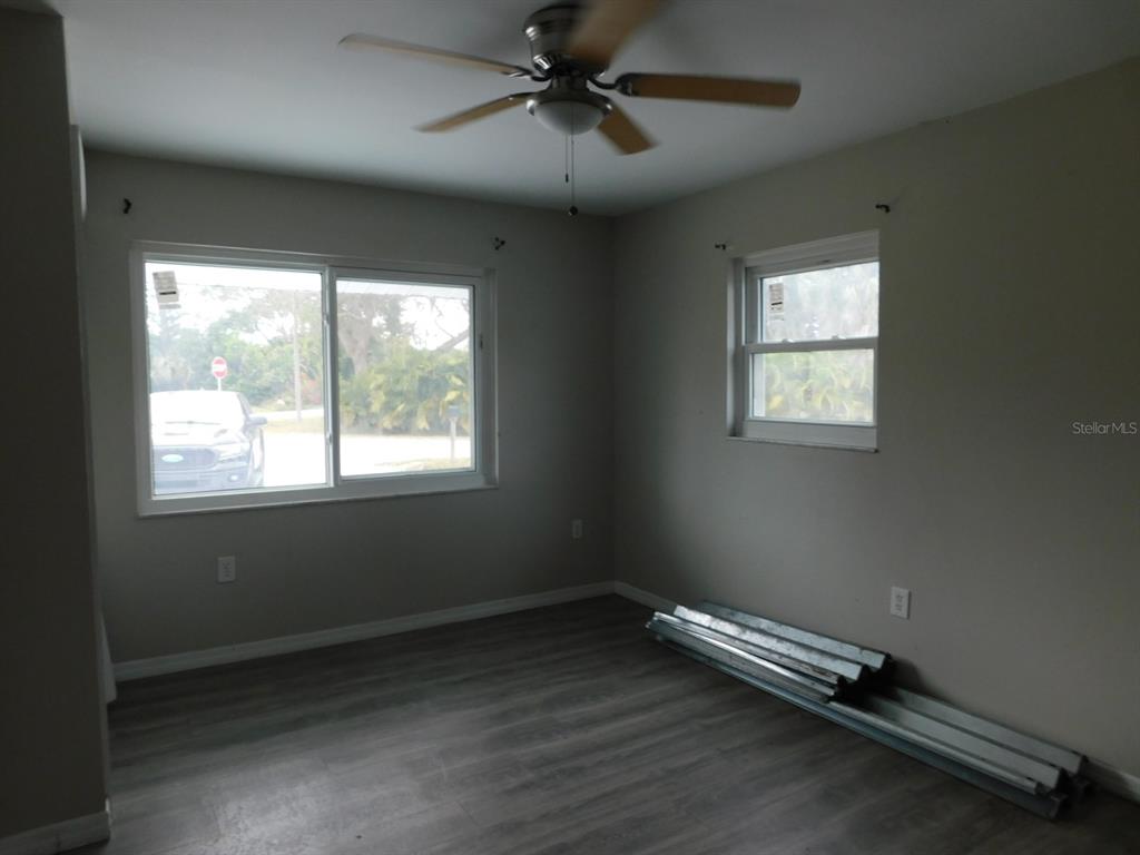 4721 Pompano Road Venice, FL 34293 - Photo 8 of 13 a view of room with window and ceiling fan