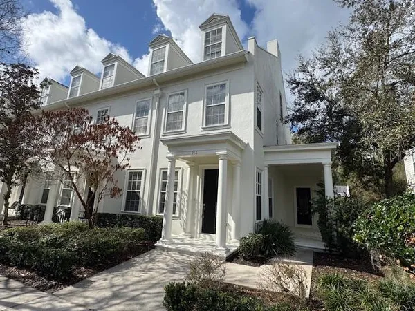 a front view of a house with garden