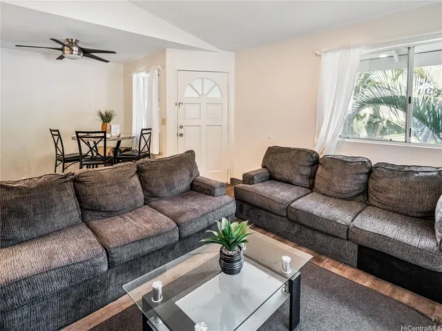 a living room with furniture and a window