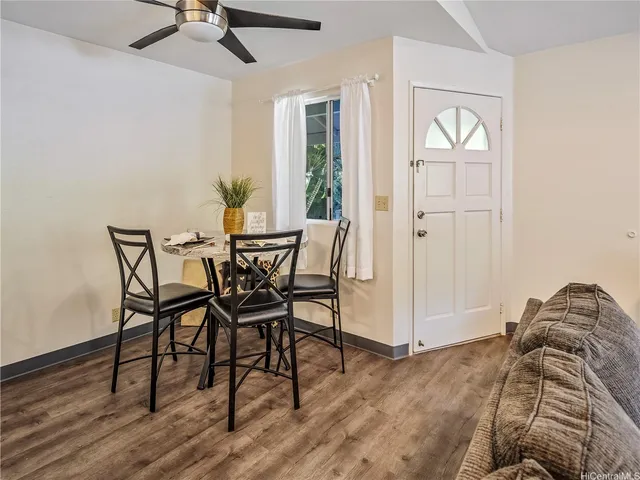 a view of a livingroom with furniture and wooden floor