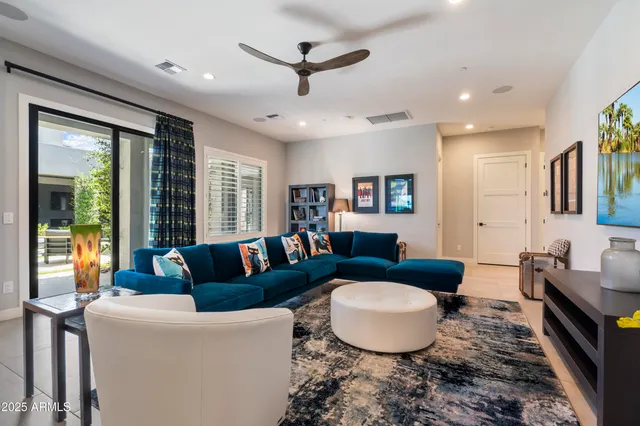 a living room with fireplace furniture and a flat screen tv