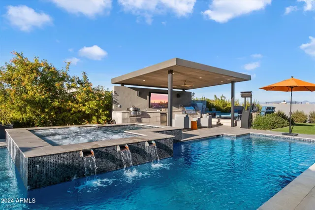 a outdoor space with patio the couches and a fireplace
