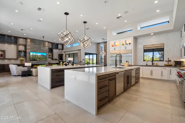 a large kitchen with stainless steel appliances lots of counter top space