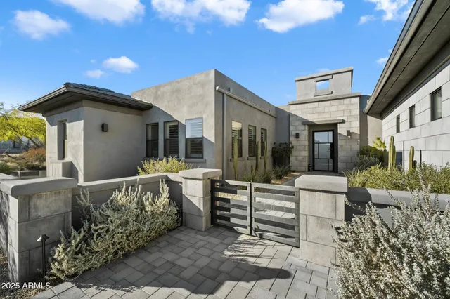 an aerial view of a house with swimming pool