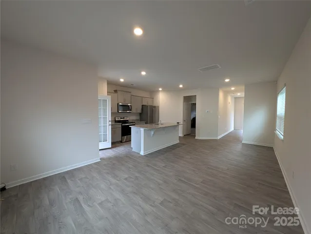a view of kitchen with wooden floor