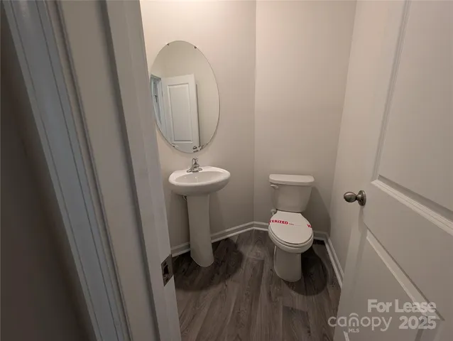 a white toilet sitting next to a sink