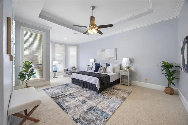 a bedroom with a large bed and a couch