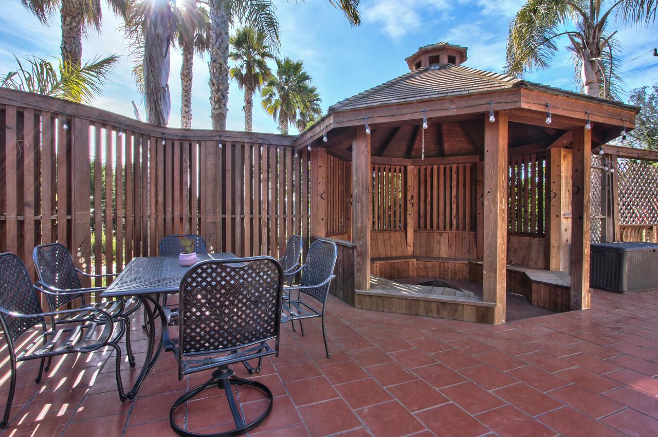 545 Pini Road Watsonville, CA 95076 - Photo 15 of 18 a view of a chairs and table in backyard