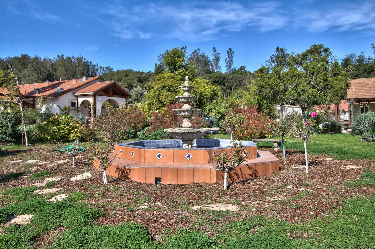 545 Pini Road Watsonville, CA 95076 - Photo 16 of 18 an outdoor space with seating area and trees in the background